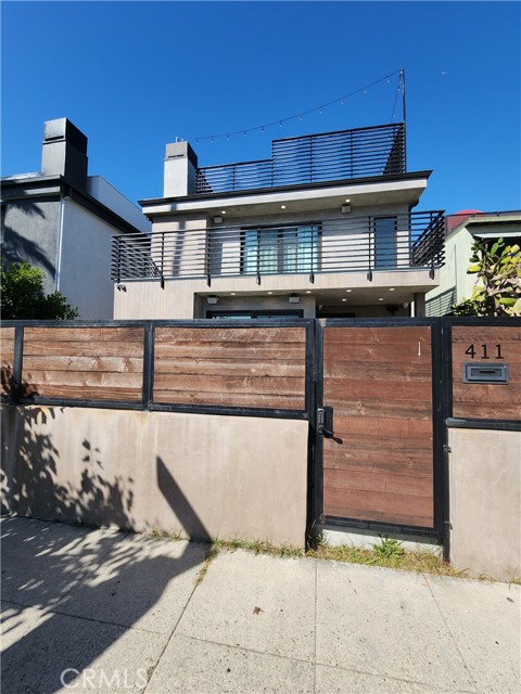 411 Grand Boulevard Venice, California Introducing an extraordinary gem in the heart of Venice, California, this stunning modern residence boasts unparalleled architectural craftsmanship. With four spacious bedrooms and three and a half luxurious baths, this fully furnished home redefines coastal living.
Step onto the rooftop deck and soak in panoramic views, or access your private 2-car garage, offering convenience in the bustling neighborhood. Uniquely featuring two kitchens, this home embraces versatility, while the master bedroom dazzles with a floating tub, creating an oasis of relaxation.
Nestled just two blocks from the iconic Abbott Kinney, this home's prime location offers the best of both worlds - tucked away in privacy, yet only minutes from the sun-kissed shores of Venice Beach. Don't miss this rare opportunity to live in a one-of-a-kind masterpiece, where modern living meets beachside serenity.