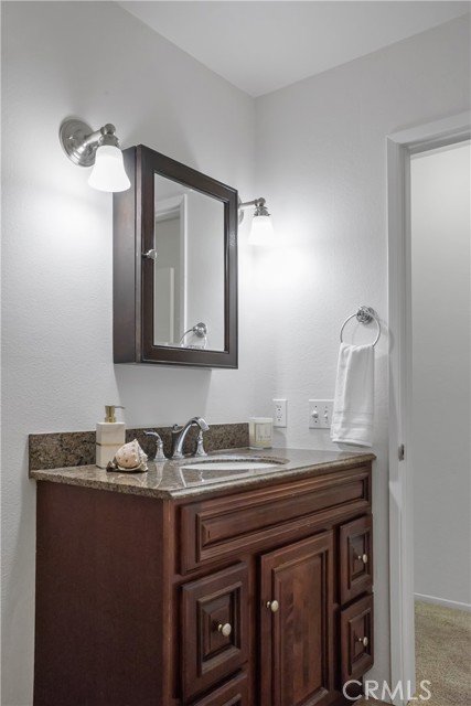 Hall bathroom with granite vanity