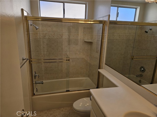 Another bathroom with a shower and tub