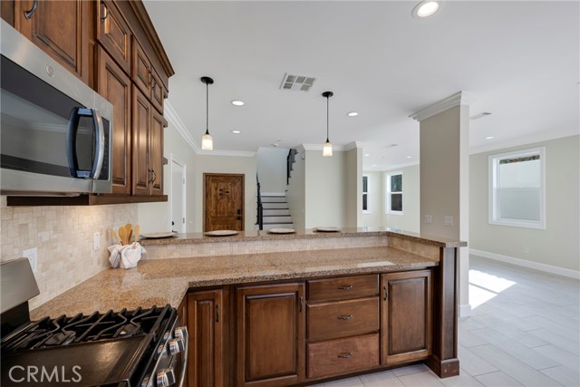 Open concept kitchen has views to living room.