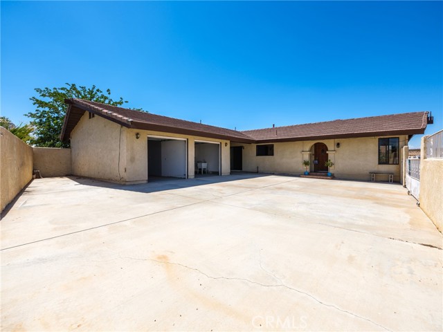 Shows added parking to left of garages.