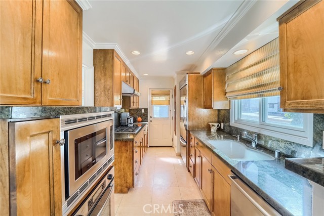 Kitchen with granite counters and stainless appliances.