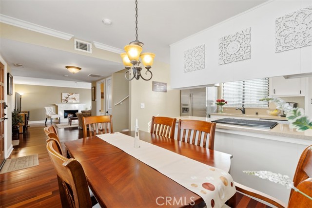 Formal dining-room, attached kitchen, warm colored paint