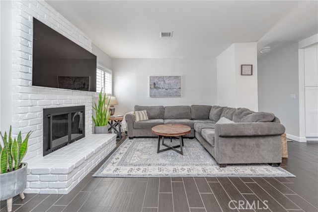 Formal Living Area with Wood Fireplace!