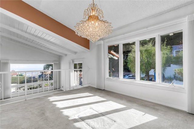 Dining room with view of living room picture window