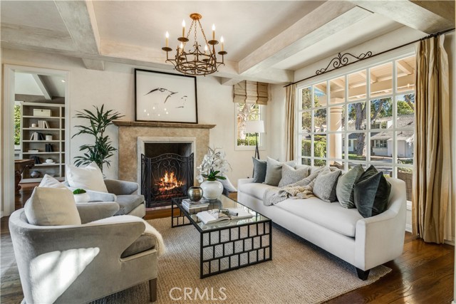 Beautiful living room with fireplace and picture window to the front yard.