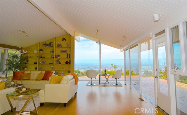 Open floor plan and walls of glass take advantage of the panoramic city, canyon and mountain views from this contemporary style home.