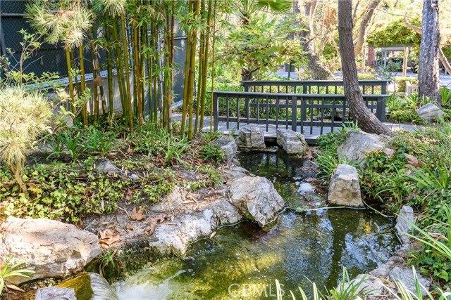 Resort like grounds complete with bridges and water falls and lots of mature trees.