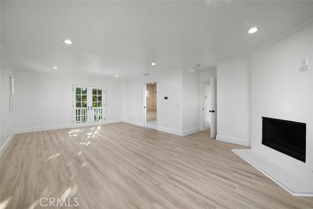 View of primary bedroom retreat complete with balcony