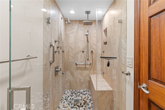 Remodeled Primary walk-in shower with rain shower and body jets.