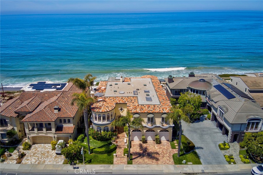 Majestic bluff front Mediterranean estate with sweeping ocean vistas in the exclusive enclave of Cyprus Cove! Commanding an enviable position on the oceanfront bluff within the prestigious, guard-gated community of Cyprus Cove, this custom-built estate offers nearly 8,000 square feet of luxurious coastal living, with unobstructed, panoramic ocean and whitewater views. The soothing sound of waves crashing creates a sense of serenity that is truly unmatched. The interior is designed to impress, featuring soaring two-story ceilings, floor-to-ceiling windows, and expansive living spaces that seamlessly blend indoor and outdoor living. From the gourmet kitchen, luxurious primary suite, executive office, and more, enjoy unparalleled ocean views that elevate everyday living. With 6 spacious bedrooms and 5.5 bathrooms, the home includes a grand, ocean-facing primary suite complete with a private balcony, retreat, fireplace, and breathtaking whitewater ocean views. A thoughtfully designed lower level offers guest quarters with a private entrance, an ideal accommodation for many. The backyard oasis is a true sanctuary, complete with a sparkling pool, spa, built-in BBQ, and manicured grounds, all set against the backdrop of the endless Pacific horizon, perfect for entertaining or serene sunset lounging. Residents of Cyprus Cove enjoy private beach access, a community clubhouse, pool and spa, tennis and basketball courts, and a beachfront park, making this a truly exceptional coastal lifestyle opportunity. Ideally situated just moments from San Clemente’s charming boutique shops and renowned dining on Del Mar, the San Clemente Pier, beach trail, and world-class surf breaks, this rare oceanfront estate offers access to a vibrant coastal lifestyle!