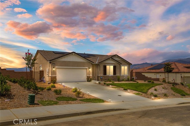 This amazing VIEW  home will WOW you from the moment you walk in the door! Offering unobstructed, panoramic VIEWS FOREVER!   Enjoy privacy and space along with the scenic landscape of rolling hills and mountain ranges.  This PREMIUM, OVERSIZED LOT is a blank slate with endless possibilities! Tucked up high in the hills of the Calimesa community of Summerwind Trails, surrounded by miles of  open space and acres of dedicated parks, picnic areas, sports fields, hiking trails and more! NEWER CONSTRUCTION, this  Decker Plan built by Richmond American Homes was completed in September of 2021 and is Move in Ready! Stunning architectural design with lots of natural light.  Spacious SINGLE LEVEL with open concept floor plan, ideal for large gatherings or relaxed everyday living!   Well appointed kitchen which opens to the great room and backyard. Special features include a large center island, natural stone countertops, custom tile backsplash, white thermafoil cabinetry, dual ovens, 36” stainless steel 6 burner gas cooktop and large pantry. Master suite has views to the back and a large  spa inspired en-suite with  walk -in closet, soaking tub, separate shower and dual sink vanity.  Convenient indoor laundry room. Many upgrades through out the home including OWNED SOLAR PANELS , 8’ doors throughout, recessed lighting, electric car charger, ring security system  and upgraded electrical with data cables. Great location! Just minutes from schools, shopping, restaurants and easy freeway access. Don’t miss out! CALL NOW to make your appointment to see this spectacular home!