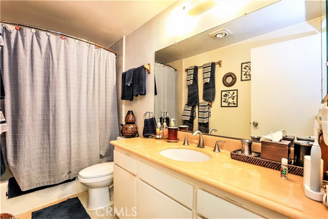 The Second Full Bathroom has a Large Vanity and a Shower Tub.