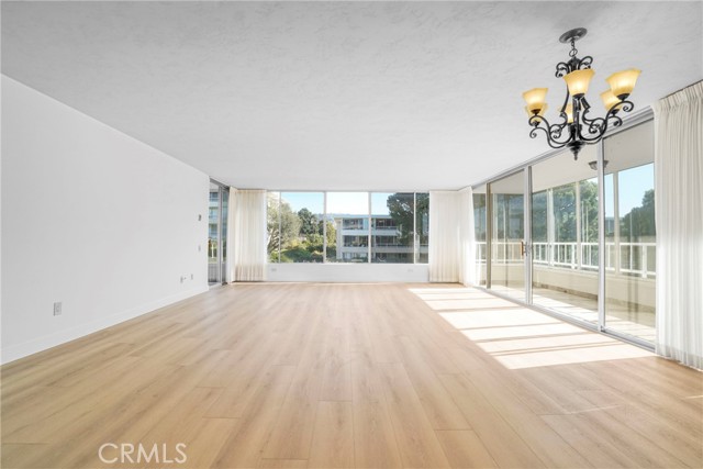 Family room with Wall to floor windows and lots of natural light.