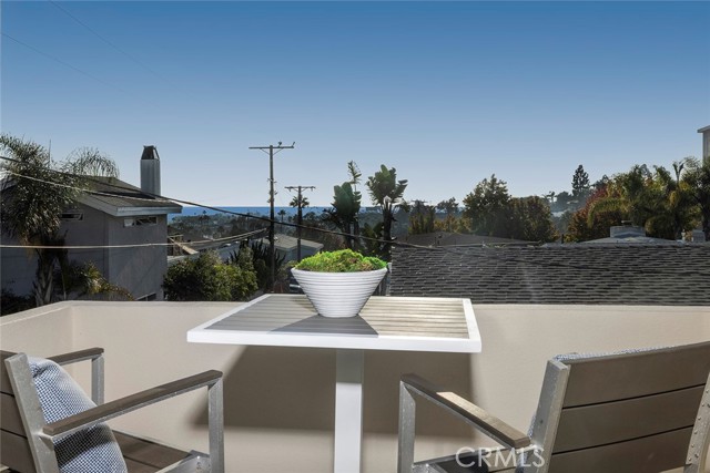 Enjoy Ocean Views and on this cozy and private patio off of the Primary Bedroom.
