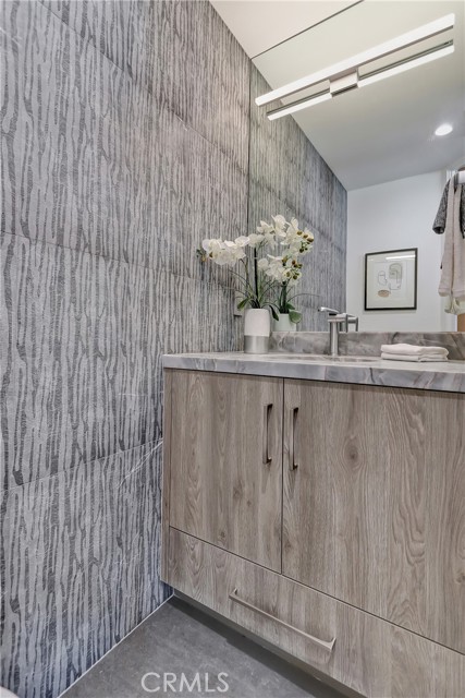 Powder Room with etched marble walls