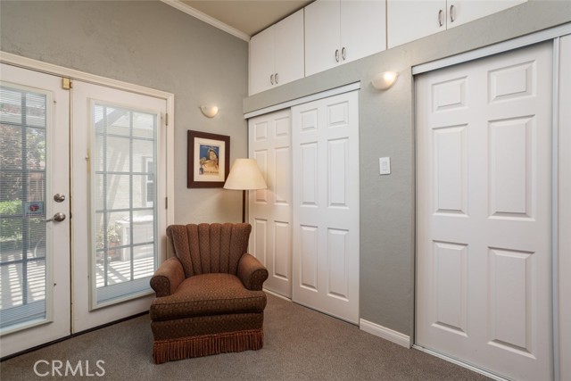 Primary bedroom, doors to backyard