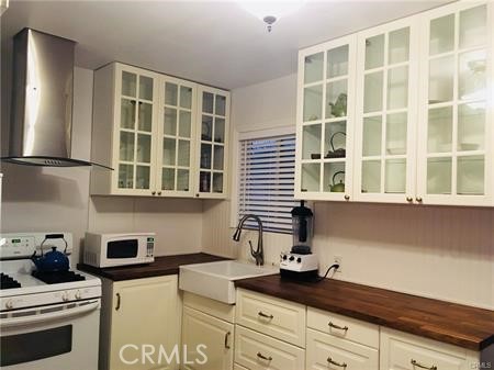 Updated kitchen. Butcher block counter & easy close cabinets.