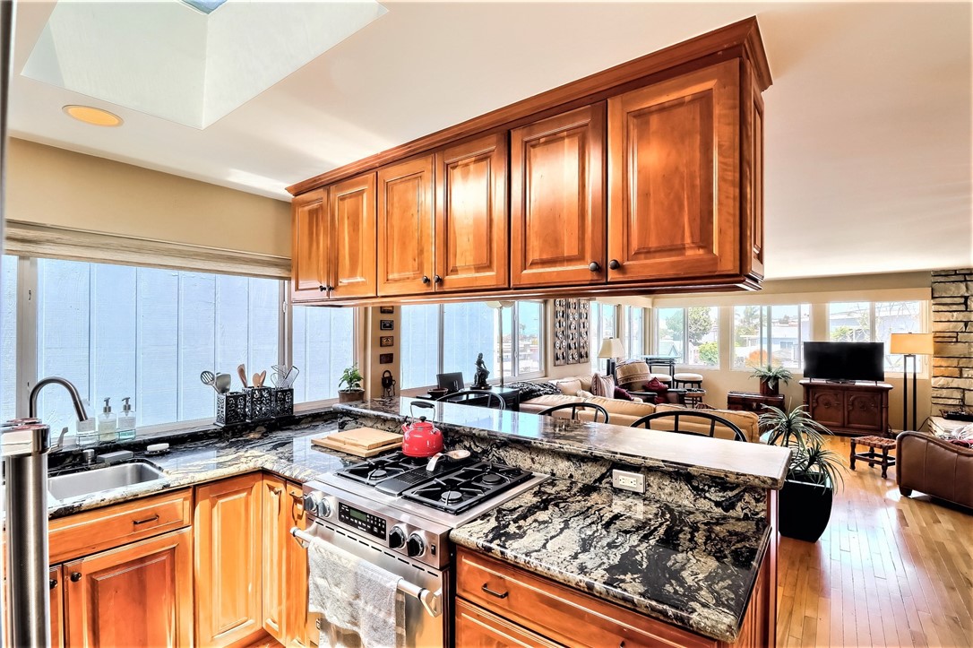 The Kitchen has Beautiful Granite Counter Tops and a Quality Custom Range
