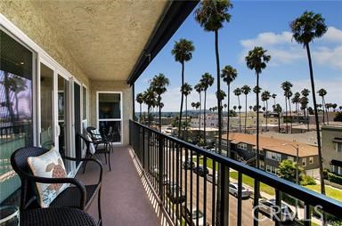 110 Termino Avenue 301 Long Beach, California This Ocean View Belmont Heights Penthouse checks all the boxes and more! Completely remodeled 2 bedroom 2 bath with over 1400 sq ft
of living space includes 2 deeded garage spaces with ample storage. This highly upgraded corner unit has an abundance of windows with a
views of the pacific, Catalina Island and beautiful sunsets. The kitchen has been completely remodeled with white soft-close
cabinets/drawers, quartz countertops, designer backsplash, new kitchen Aid stainless appliances including, refrigerator, built-in drawermicrowave and stainless range/hood. Luxury laminate wood flooring creates a bright, beachy feel throughout. The 2 spacious bedrooms
are like dual masters, one with a huge walk-in closet the and the other with dual closets. Both bedrooms are ensuite with their own baths,
both of which are completely remodeled. Large in-unit laundry room has quartz counter-tops and a full size washer and dryer which is
included. Other upgrades include a kitchen skylight, newer dual-pane windows, upgraded baseboards, frosted glass interior doors,
recessed LED lighting, Restoration Hardware fixture in dining and multiple ceiling fans. The secured building has a newly remodeled lobby
and interior elevator with access to the 3 floors of residences. Low HOA includes water, trash, sewer, elevator, secured access, beautiful
lobby and gardens. This ideal location in a quiet residential neighborhood is just steps from the sand, shopping, pier, and restaurants.