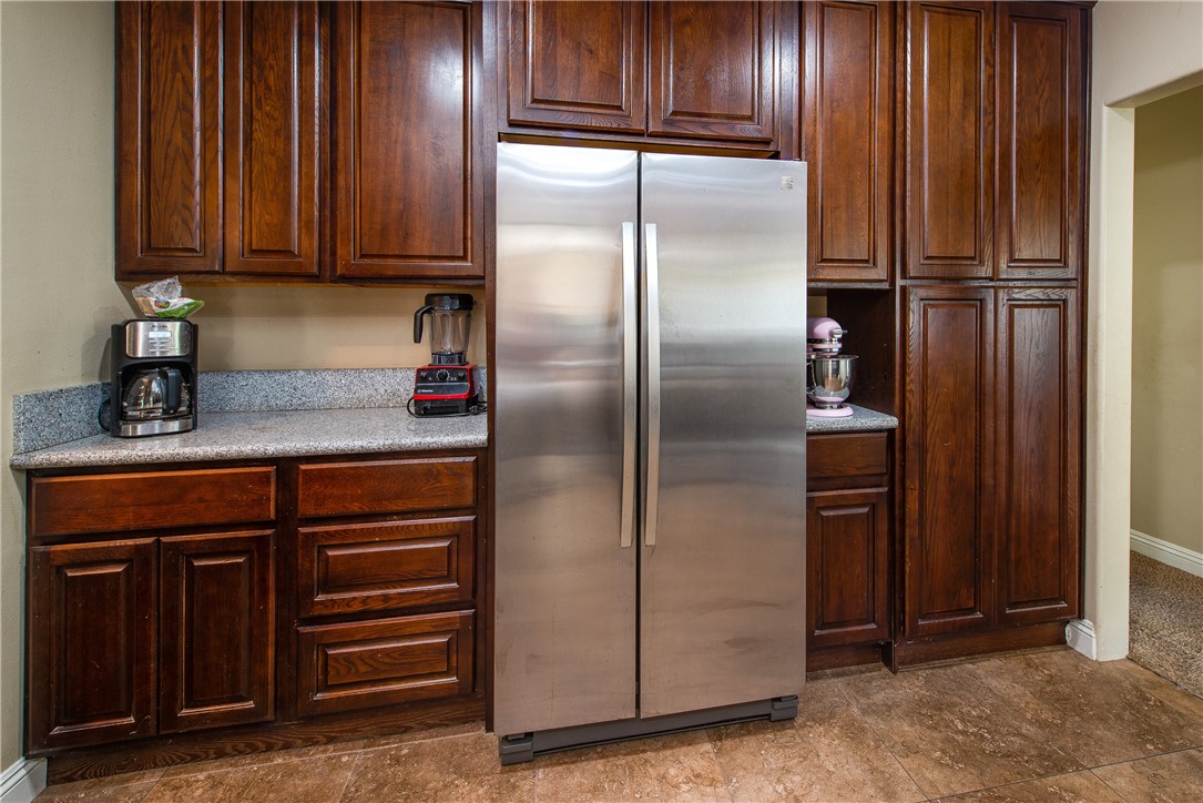 There is plenty of storage in the many cabinets in the kitchen.