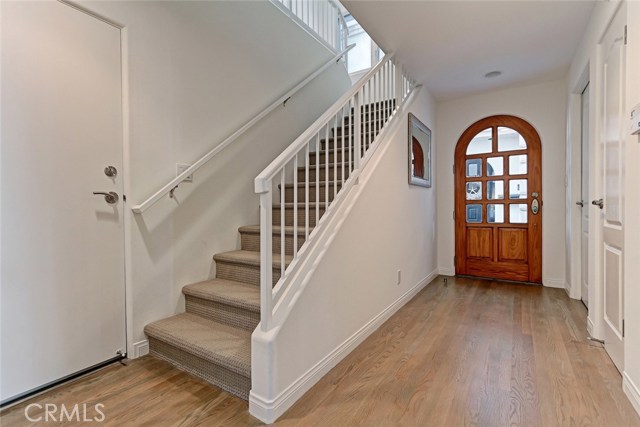 first level has laundry room and bedroom with a set of patio doors to back patio