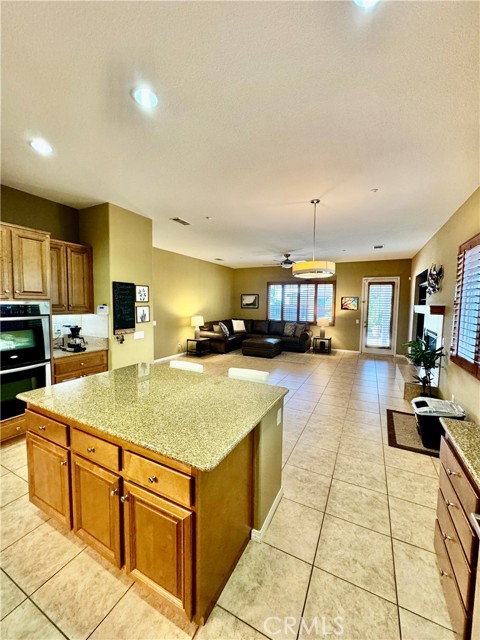 Open concept kitchen with recessed lighting.