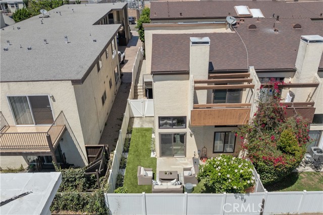 Large L-shaped yard allows for room to play games or have a dog run