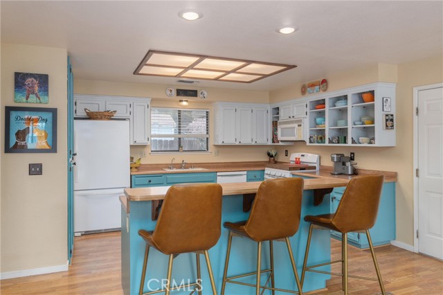 Spacious kitchen with an island, eating bar and pantry.