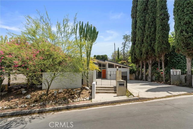 3674 Willowcrest Avenue Studio City, California Tucked into a serene and sunny stretch of the coveted Wrightwood Estates in Studio City, this one-of-a-kind mid-century modern gem offers the perfect balance of timeless design, natural light, and indoor-outdoor living. A Schindler influenced home with timeless style has 3 spacious bedrooms and 2 bathrooms, the home features vaulted ceilings, a wide-open living space and a stunning bonus room surrounded by windows that flows seamlessly into the surrounding landscape. Step inside to find expansive Clerestory windows, skylights, and an airy layout that captures the golden Southern California light throughout the day. A large kitchen with a breakfast nook, built-in shelving and connected to the expansive laundry room. Whether you’re hosting a dinner party or enjoying a quiet morning coffee, the connection between nature and home is undeniable with tranquil vibes and space to breathe. Situated on an extra-wide, open street, this home feels both private and welcoming, ideal for entertaining or simply living beautifully. Located in the Carpenter Community Charter School and minutes from Ventura Boulevard's shops & restaurants. Don’t miss your chance to own a true hillside retreat in one of Studio City’s most desirable neighborhoods.