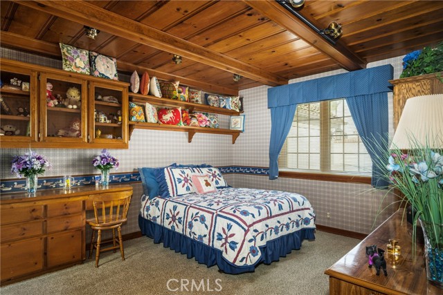 Rustic Bedroom with Built-In Shelving and Warm Wood Accents