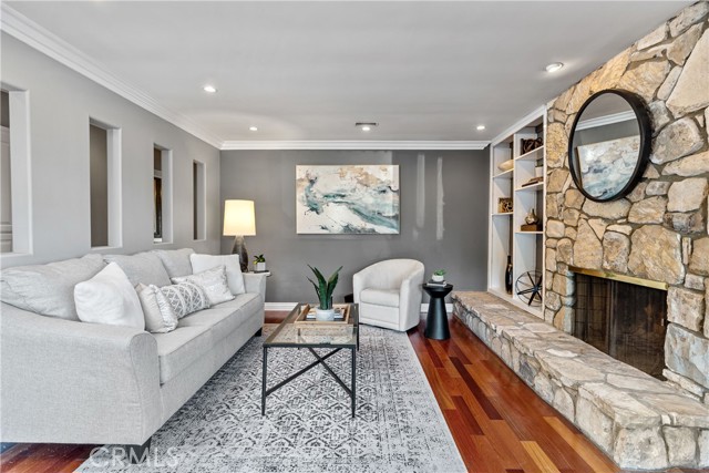 The formal living room with tasteful designer color tones, rich hardwood flrors and recessed lighting.