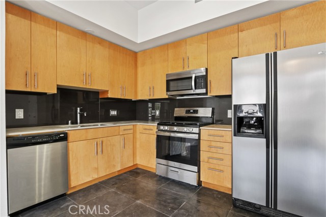 133 The Promenade N 303 Long Beach, California Downtown in LUXURY and STYLE! Just Painted! Ultra Modern 760 sqft open spaced loft style condo! Upgraded with 5 star appointments. Insulated from the city. Treat yourself to custom lights & paint! Lots of natural light. Tile Floors throughout! No Carpet! Stainless steel appliance package with large upgraded open spaced granite gourmet kitchen. Gas Stove! 1 extra unique corner location sky window in located in living room. Huge bedroom area. 1 assigned gated underground parking space with complementary guest parking! 1 Large Storage Cage. FIOS internet and basic expanded cable included. The building offers a trendy modern clubroom complete with TV, sofas, pool table, shuffle board, full size kitchen, outdoor social patio bar and courtyard lounge area with fireplace. A modern gym/fitness center, yoga room, TV’s. 0-5 blocks away from everything!(Promenade, beach, boardwalk, restaurants, museums, grocery stores, shopping, freeways & entertainment, annual Grand Prix, Laugh Factory, The Pike, Nike, H & M outlets, marina, Queen Mary, jet skis & boat rentals, paddle boarding, Pine Ave, Belmont Shores & more!)