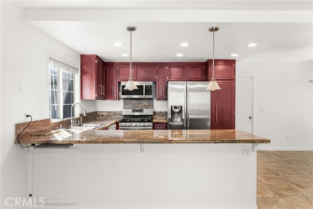 Kitchen with counter top dining area