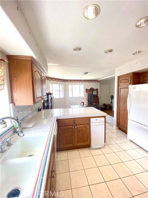 Beachy tile reminds us that although this home was decorated primarily in Victorian, it is still in Upscale Redondo Beach, and a short jaunt to the beach.