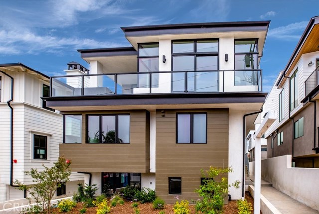 937 15th Street Hermosa Beach, California Welcome to Hermosa Hills and this one of a kind coastal-contemporary townhome which brings a little east coast vibe to a west coast lifestyle. Designed by one of the South Bay’s finest architects, Doug Leach, this warm and welcoming home incorporates exquisite design elements and functional features that ties sophistication with a casual coastal vibe. Consisting of four bedrooms and five bathrooms, with approximately 3,300 sft. of living space, a gourmet kitchen that includes Viking appliances, a spacious large island, custom made cabinetry, and floor to ceiling windows that opens up to a grand patio, perfect for outdoor dining and lounging. Retreating to the master suite, you will find abundant natural light, open space, high ceilings, and a luxurious en-suite bath. Two additional en-suite bedrooms complete the second floor and a lower level, fourth en-suite bedroom makes for an ideal office, gym or guest quarters. Host gatherings in your chef's kitchen and continue the celebration outdoors on a jaw-dropping rooftop patio, all while taking in the cool ocean breeze and incredible views of LA's most desired coastline from Palos Verdes to Malibu. Coastal sophistication at its best, this timeless Hermosa Hills gem is simply effortless and should not be missed.