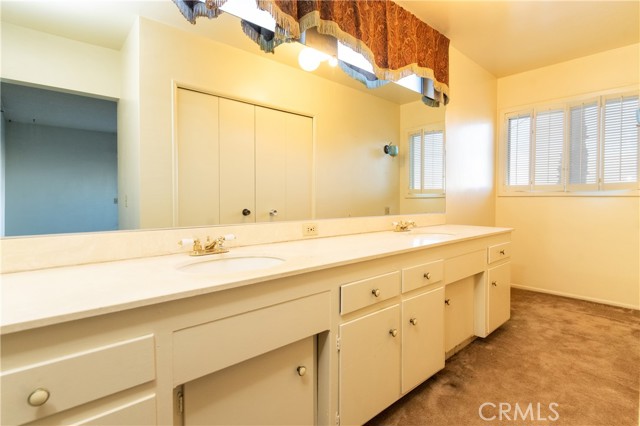 Bathroom #1: In Primary bedroom featuring double sinks