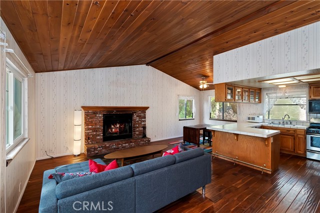 Attractive blend of wood and neutral wallpaper