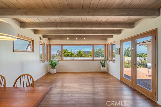 Family room with French doors that lead out to patio area