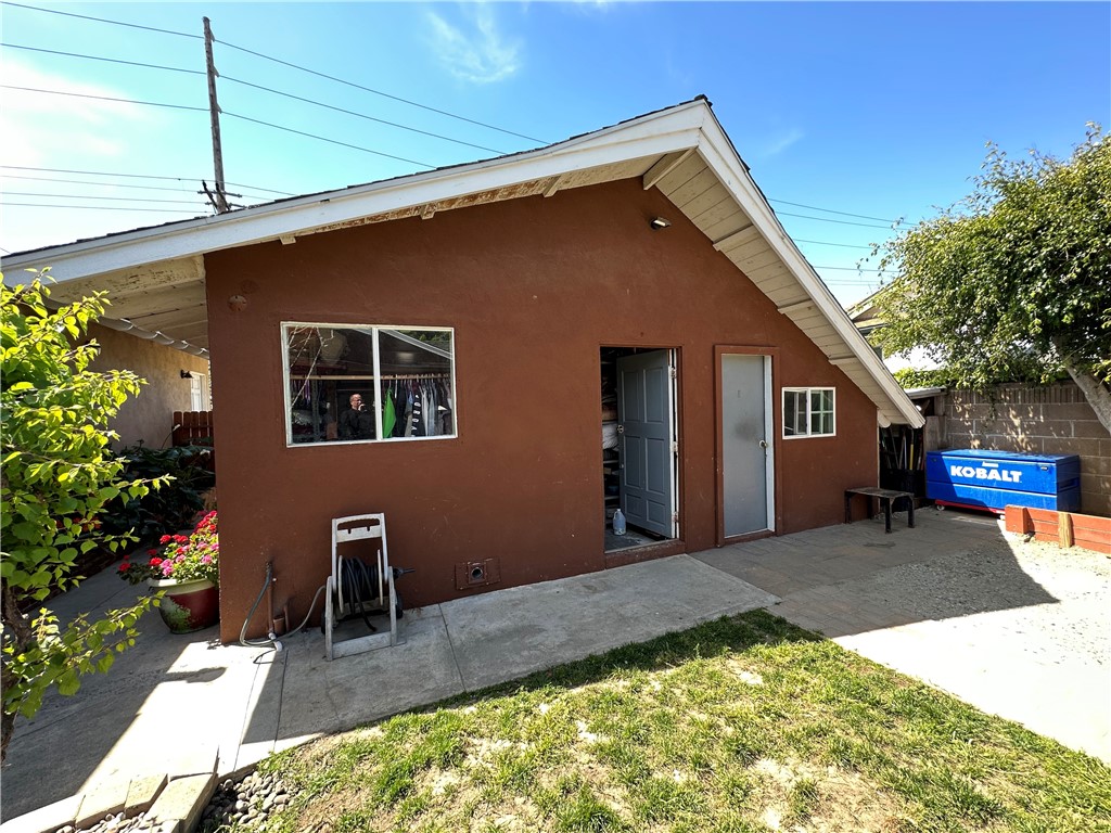 Garage pedestrian entrance with separate attached room that could be used for an office or gym