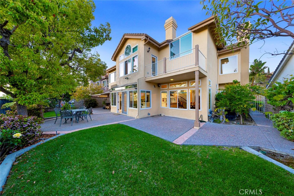 Welcome to one of the most exclusive streets in the already highly sought after guard gated community of Canyon Crest right above the beautiful Lake Mission Viejo.  Your ability to buy a house on this street has only been in your dreams!  This family home has 4 bedrooms and 5 bathrooms with a very tranquil backyard overlooking Lake Mission Viejo.  Furthermore, this floor plan includes a downstairs bedroom with an en suite bathroom.  The kitchen has been remodeled in the last year with solid wood cabinetry, quartz countertops, and stainless steal appliances. The house comes equipped with a 3 car garage and 3 driveway spaces for plenty of parking.  Have a golf cart?  Use it to drive to the Clubhouse, 1 of 3 swimming pools, tennis courts, BBQ area, picnic area, gym, and so much more that the community HOA offers!  Go a few blocks outside of the guard gated community and you will be at Lake Mission Viejo!  Your view becomes your playground with swimming, fishing, boating, and other great family activities!  Don't wait, make this your new home in the incredible Canyon Crest community before it's gone.