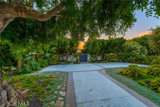 Besides the large driveway, there is also an attached 2 car garage on the back of the home