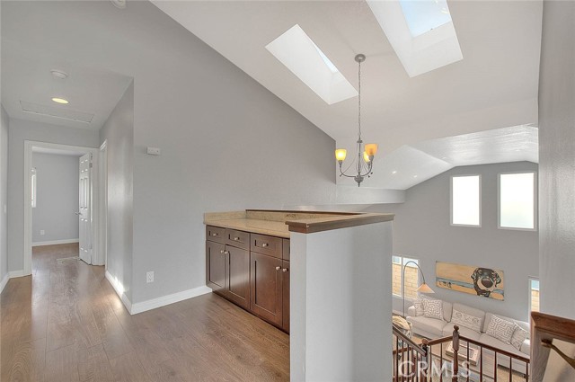 Upper landing w/skylights and linen