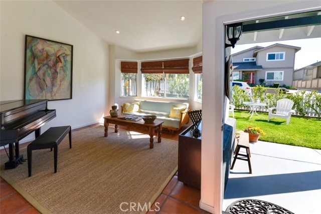 A view of the entryway and the living room.