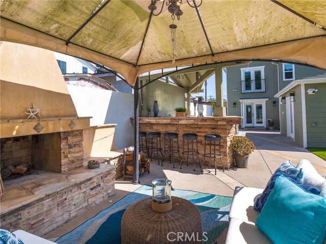 Looking from the fireplace area to the BBQ area and back of house