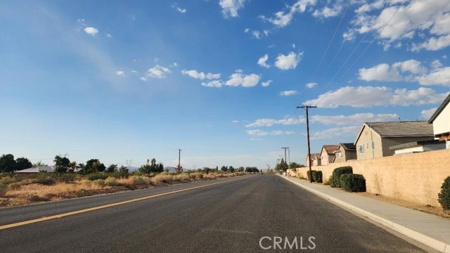 street view of nearby tract homes/street + electric poles