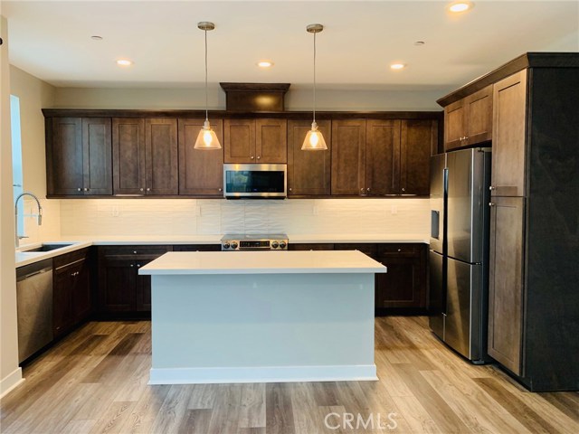 14327 Van Ness Avenue Gardena, California New 3 stories townhome has office, master suite & another mini suite, total 3.5 bath rooms. Owner spent $40K upgraded the flooring, carpet, kitchen countertop, and cabinet with the builder. 1st floor is a office with a full bath, 2nd floor is the great room, kitchen with a island, laundry and a half bath, also has a walk out balcony. 3rd floor has master suite, and another mini suite. 2 car tandem garage. Refrigerator, Washer & Dryer included.