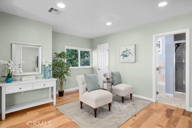 Upstairs primary bedroom sitting area.