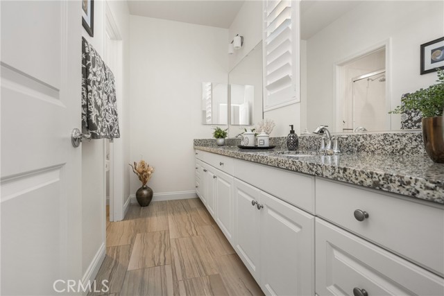 Second Bathroom with Dual Sinks and Granite Counters