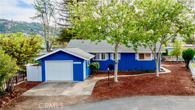 12621 Shoreview Drive Clearlake Oaks, California Lake Living at it's Finest! This 3 bed/ 2 bath home with 1,284 SF is located at the end of a quiet cul-de-sac on desirable Shoreview Dr in the Clearlake Keys! Easy lake access by boat from your very own private, covered dock + lift that has been professionally restored and resurfaced with old-growth redwood & includes a new 30' metal gangway. Enjoy summer evenings under the Weeping Willow taking in the beauty that surrounds! Many updates have been made including new interior/exterior paint, engineered laminate flooring & carpeting & new light fixtures throughout. Kitchen includes resurfaced cabinets + hardware with loads of storage, new breakfast bar, Covossi solid surface countertops, new appliances + disposal & new stainless steel basin + faucet. New water heater & indoor laundry are a bonus! Dining area off the living room & breakfast bar with new ceiling fan. The living room includes an oversized picture window to take in the water views + a sliding glass door for easy outdoor access. A stately pellet stove on brick hearth is another living room focal point. 3 comfortably sized bedrooms with ceiling fans. Hall bath includes tile countertops & walk-in tile shower. Master bath has a single sink vanity and tub/shower combo. Step outside to find low maintenance landscaping and beautiful trees that have been professionally serviced and provide outstanding shade year round. Large storage shed is a bonus! Don't miss your opportunity to own this AFFORDABLE, Turn-Key, Clearlake Channel Front home! Video Tour available upon request! |4oNl3UphGUI